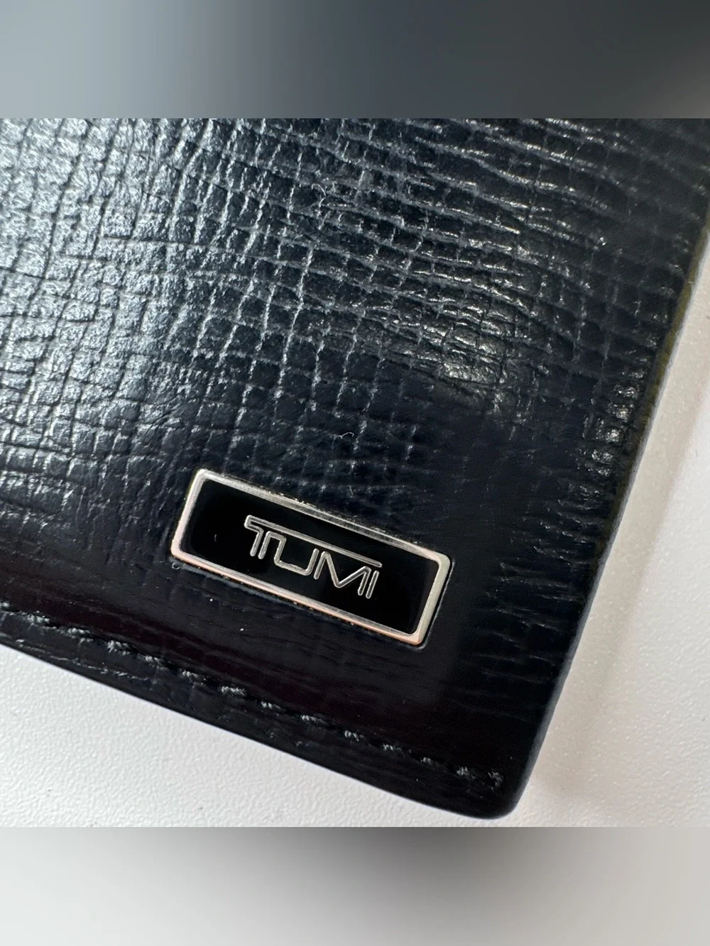 Tumi black leather